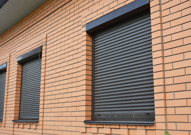 Brick House Windows with rolling shutter for house protection.