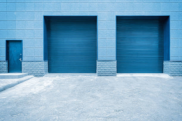 Metal blue gates and door of the shop storage.